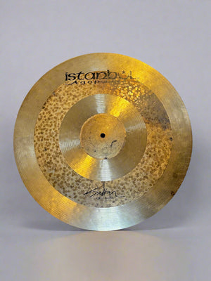Cymbal with 'Istanbul' branding on a dark textured background