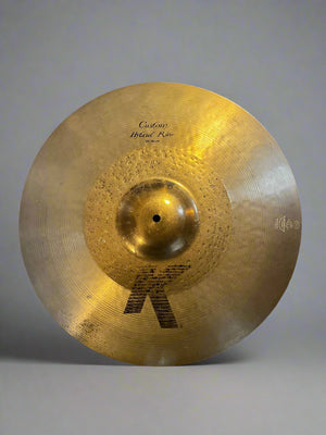 Cymbal with brand logo on a textured surface