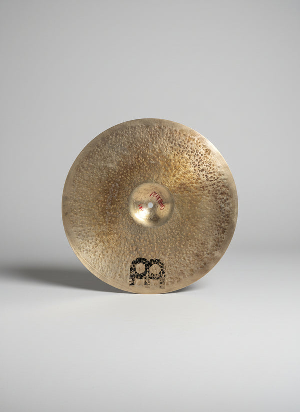 Cymbal with brand logo on a dark background