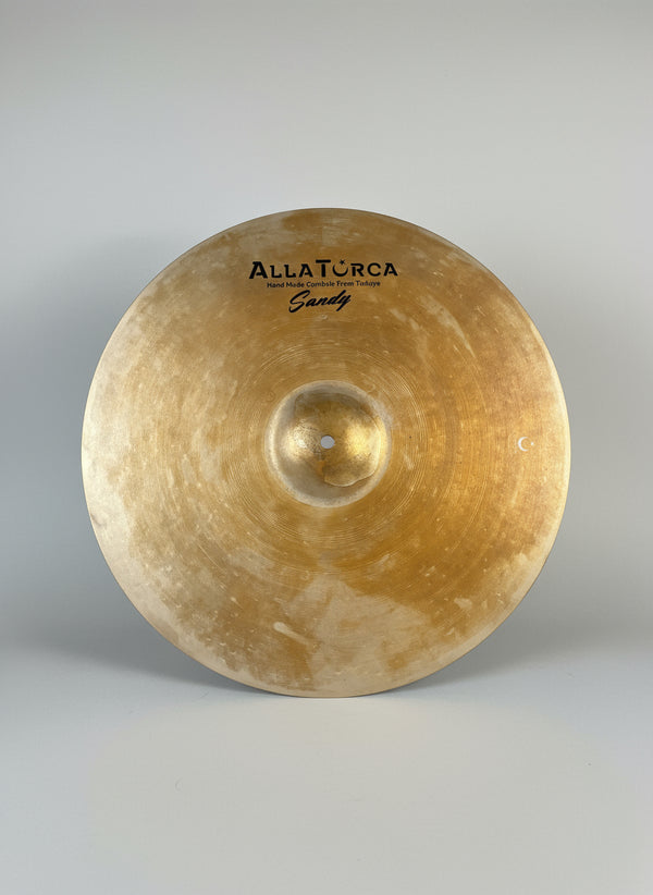 Cymbal with 'Zultan' branding on a dark textured background